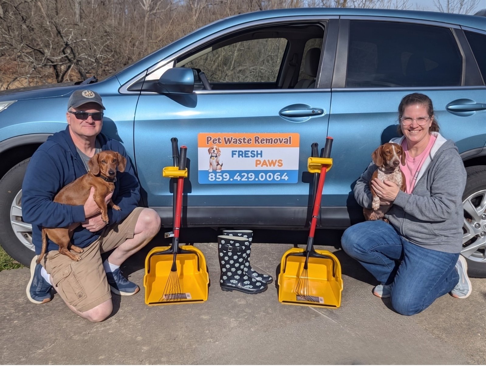 Alan and Taryn with their dachshunds and Fresh Paws pet waste cleanup equipment